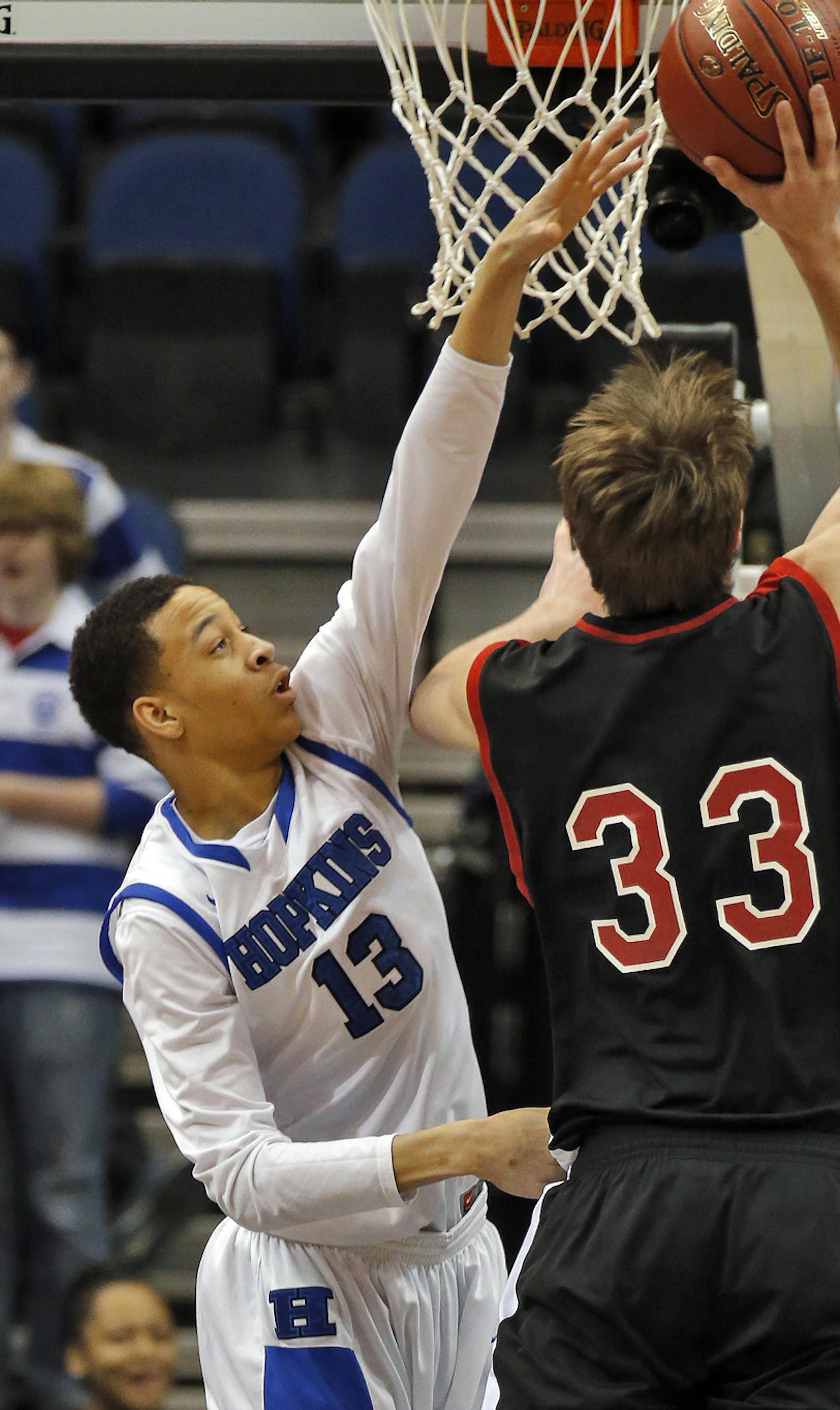 Shakopee's Tyler Weiss (33) connected for two points over the defense of Hopkins Amir Coffey (13). ] Class 4A Boys Basketball Tournament. Hopkins vs. Shakopee. (MARLIN LEVISON/STARTRIBUNE(mlevison@startribune.com)
