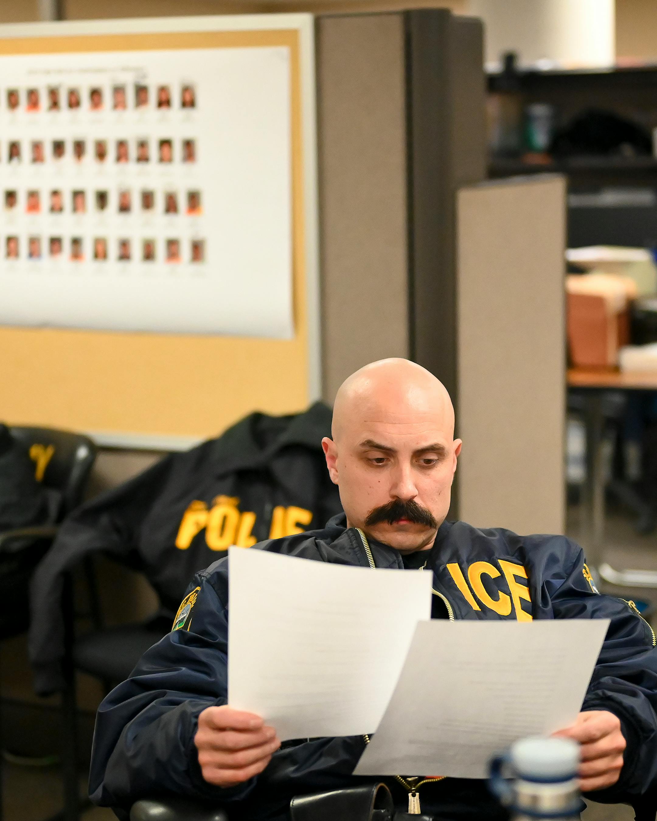 Saint Paul Police officer Zach Nayman, with the department's gang unit, was briefed before executing a warrant with his unit.