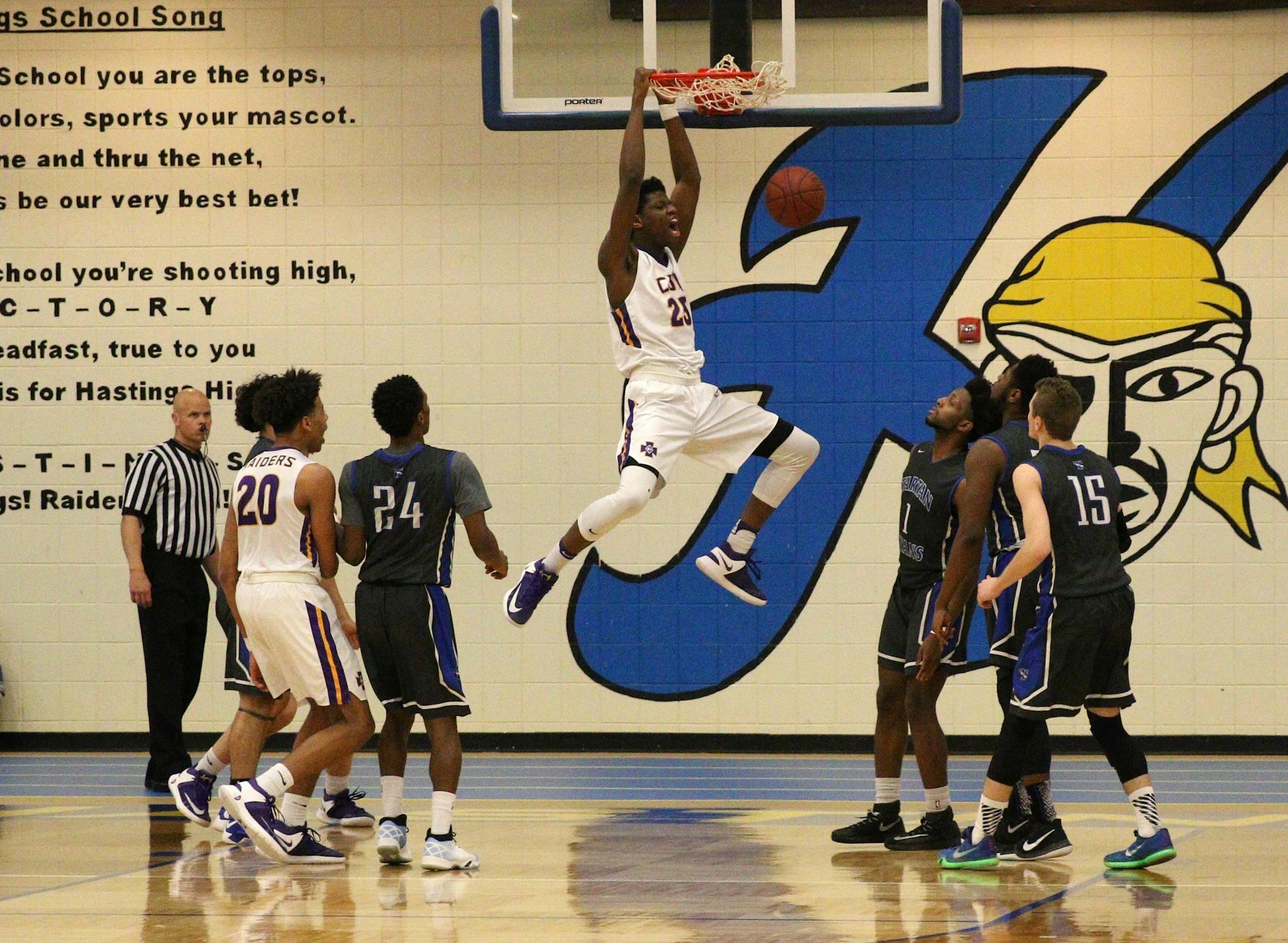 Daniel Oturu dunking for Cretin-Derham Hall, Class 4A, Section 4 championship Cretin-Derham Hall vs Tartan 3/16/2017 Photos by Cheryl Myers