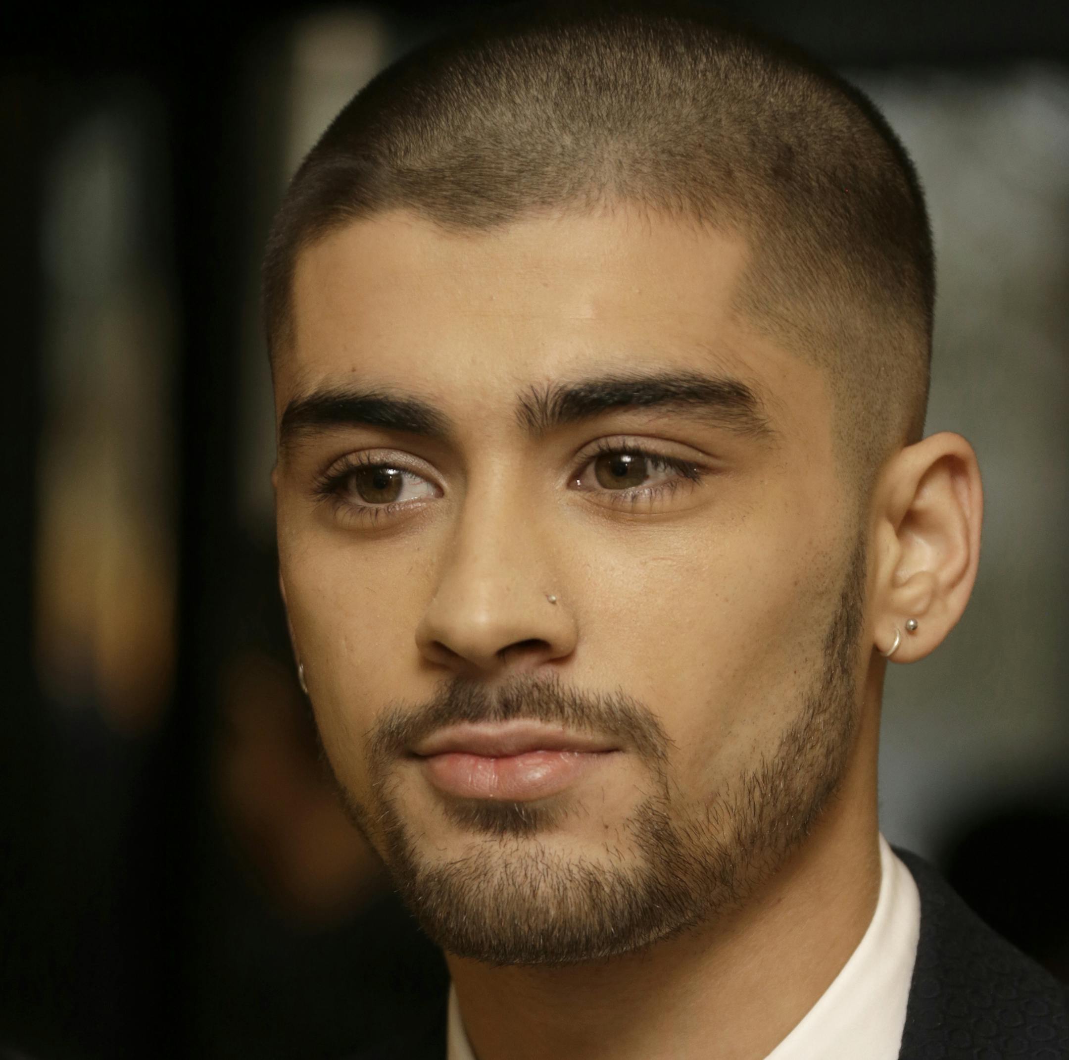 Zayn Malik poses for photographers upon arrival at The Asian Awards in central London, Friday, 17 April, 2015. (Photo by Joel Ryan/Invision/AP)