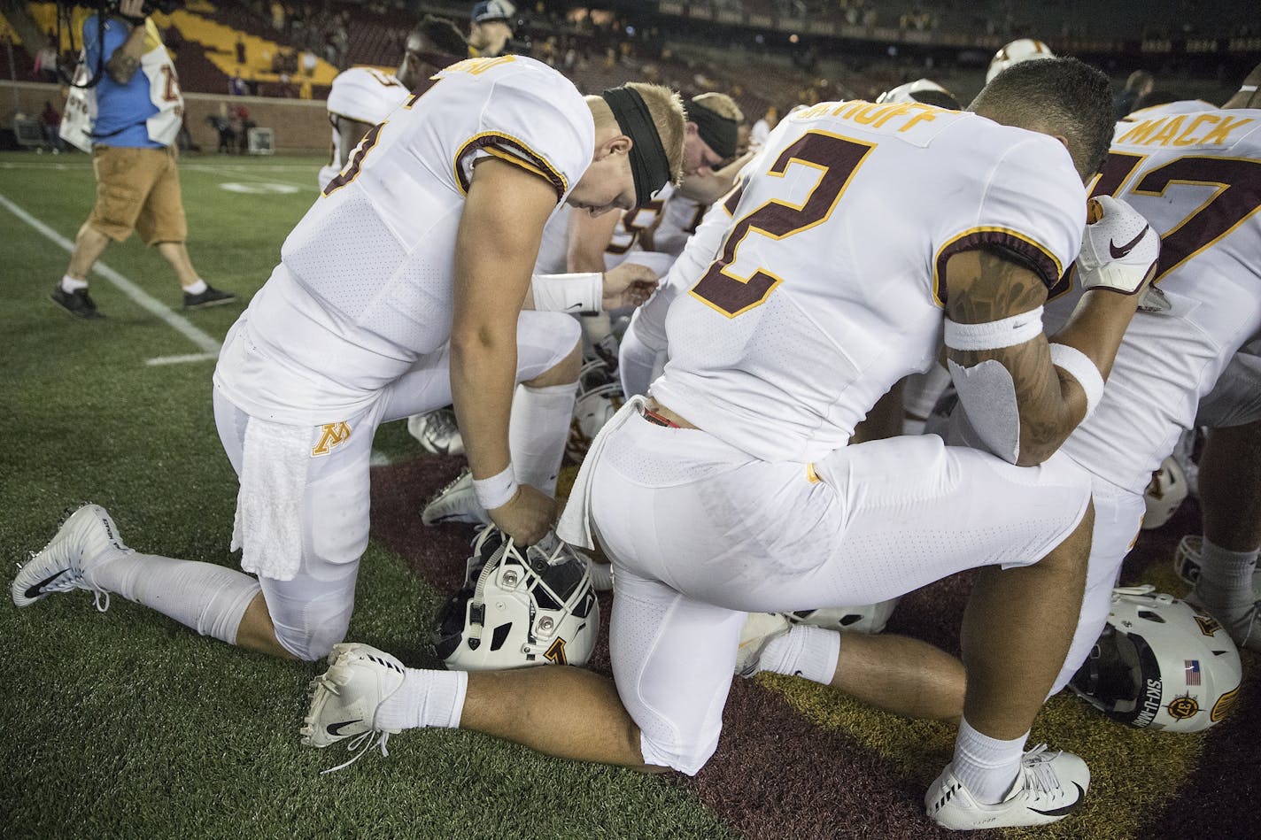 Minnesota players took a knee in prayer after the season opener against New Mexico State.