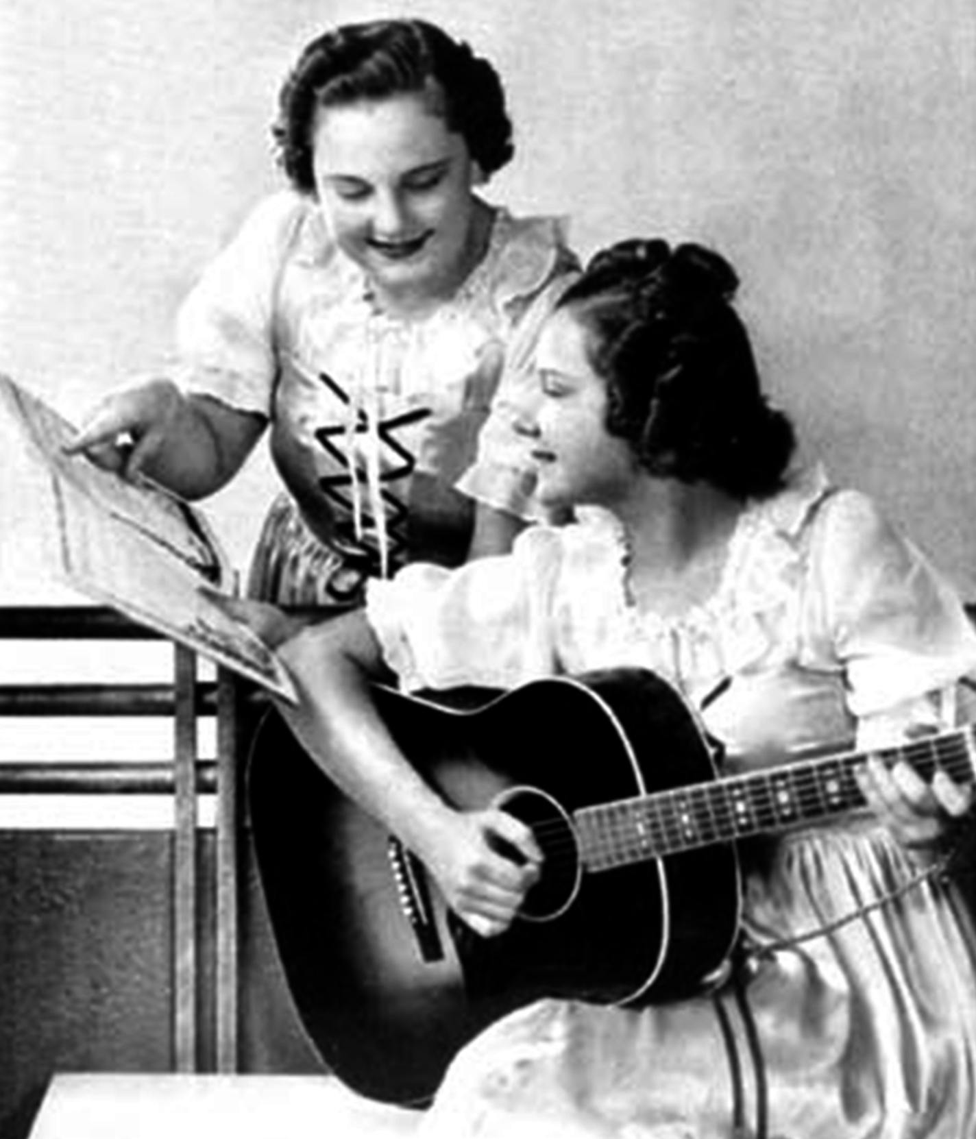 Before they yodeled and hen-clucked their way on to radio shows heard by millions in the 1930s, Mary Jane and Carolyn DeZurik were typical farm girls growing up near Royalton, Minn. Promo picture from the Grand Ole Opry