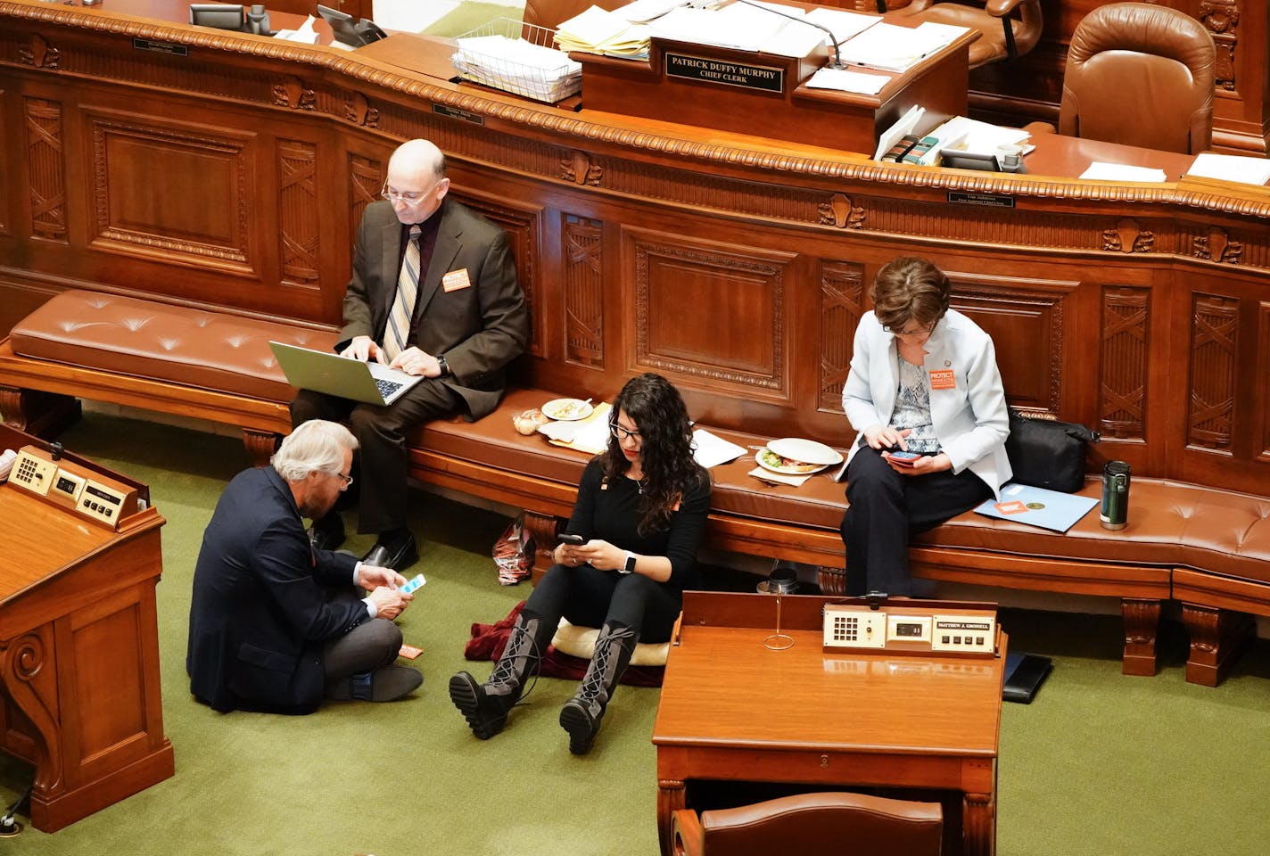 Erin Maye Quade of Apple Valley holds a 24-hour sit-in on the House floor for stronger gun laws. Other DFL reps are joining her. She is here with Raymond Dehn, Minneapolis, Peter Fischer, Maplewood and JoAnn Ward, Woodbury. ] GLEN STUBBE &#xef; glen.stubbe@startribune.com Tuesday, April 24, 2018 Some DFL members of the Minnesota House began a 24-hour sit in on the House floor Tuesday afternoon to call attention to gun violence and related policy proposals.