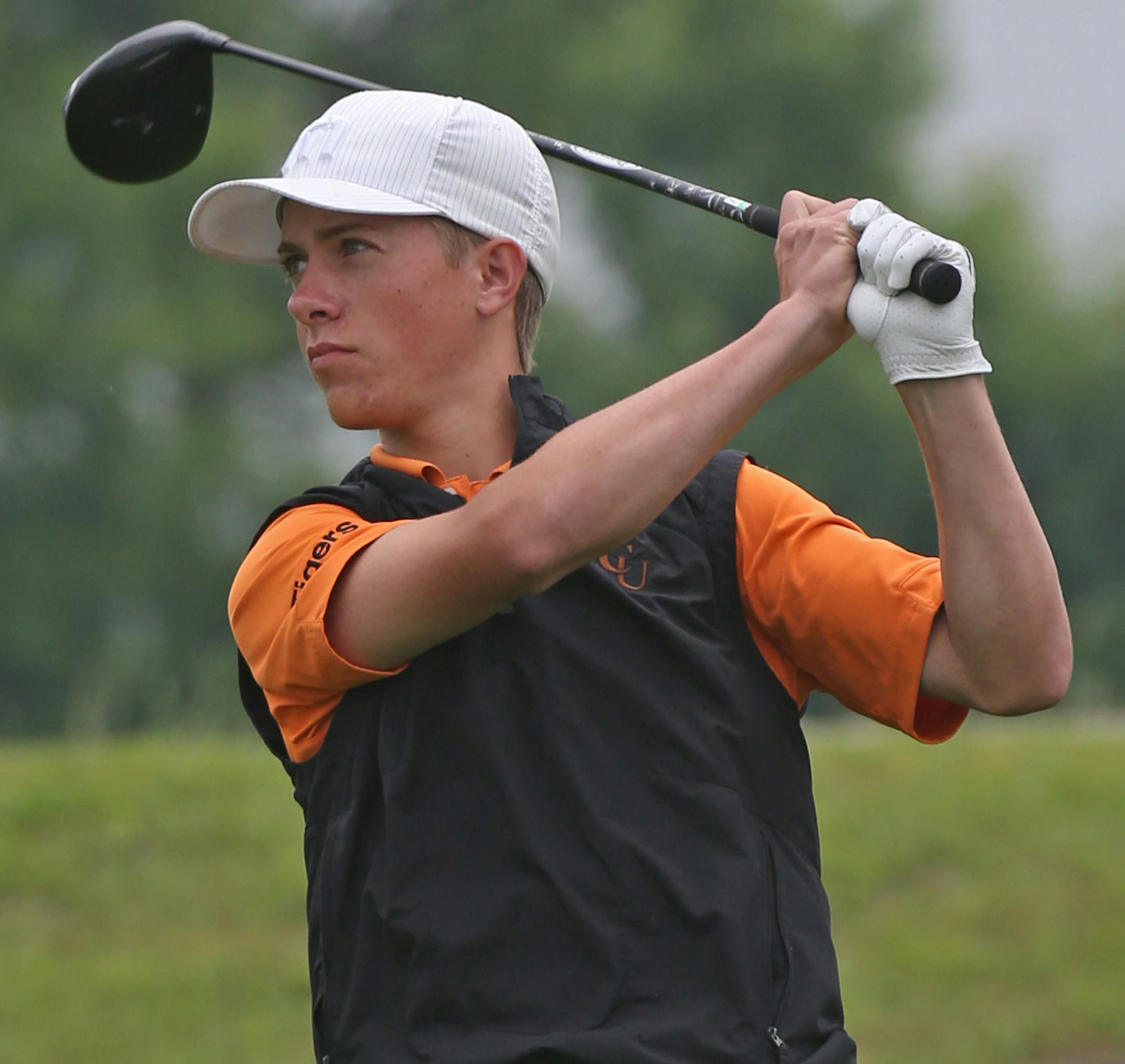 Jordan Peters of Delano teed off on the first hole Wednesday. He survived a weather delay and nerves to win the Class 2A boys’ golf tournament.