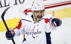 Capitals star Alex Ovechkin (8) celebrates his goal during the second period at Calgary on Monday.