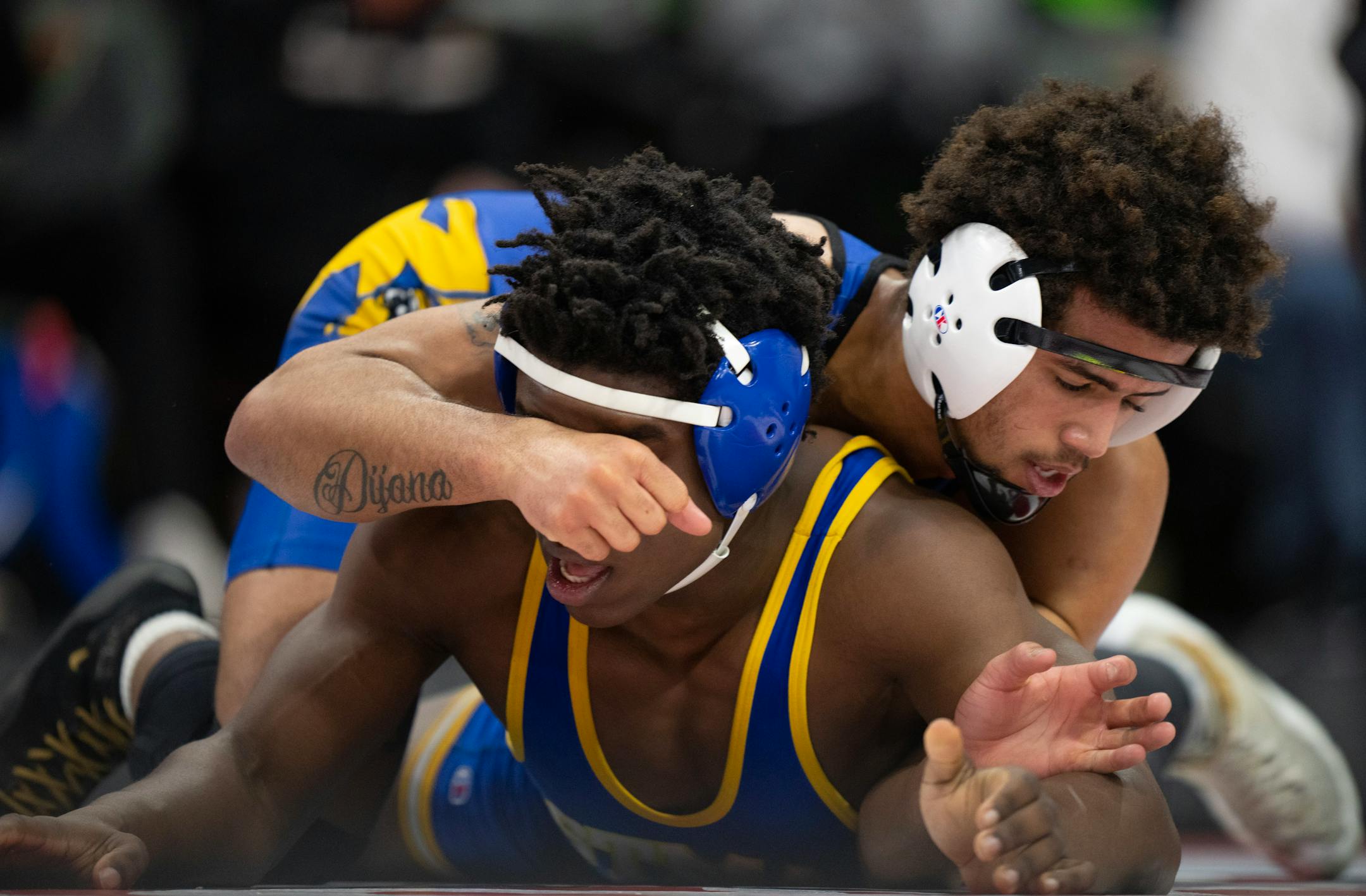Jericho Cooper of Hastings, top, on his way to a 14-8 decison over Bryon Sauvy of St. Michael-Albertville in their 182 lb. match.