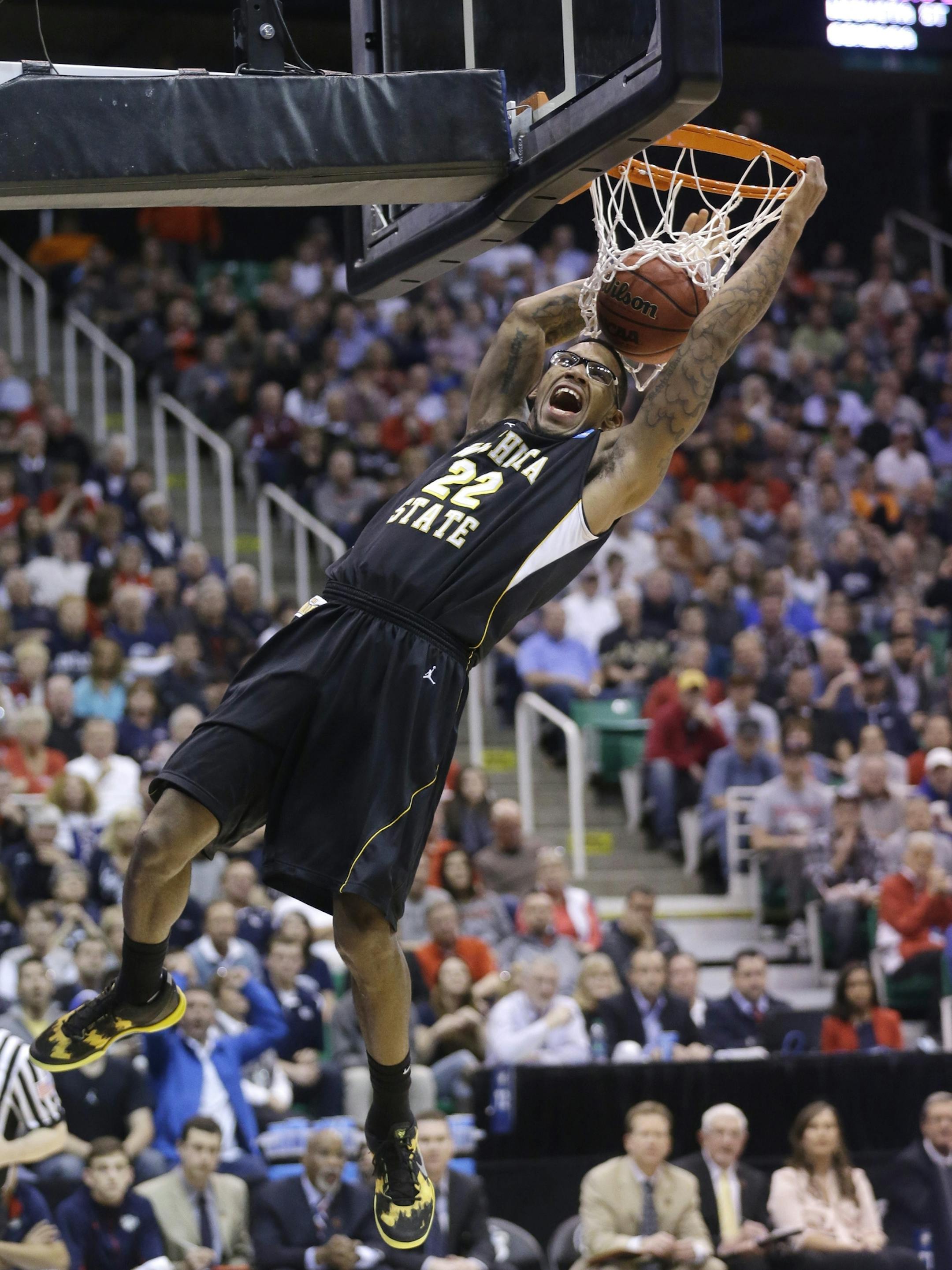 Wichita State's Carl Hall dunks the ball in the first half during a third-round game against Gonzaga in the NCAA men's college basketball tournament in Salt Lake City Saturday, March 23, 2013. (AP Photo/Rick Bowmer)