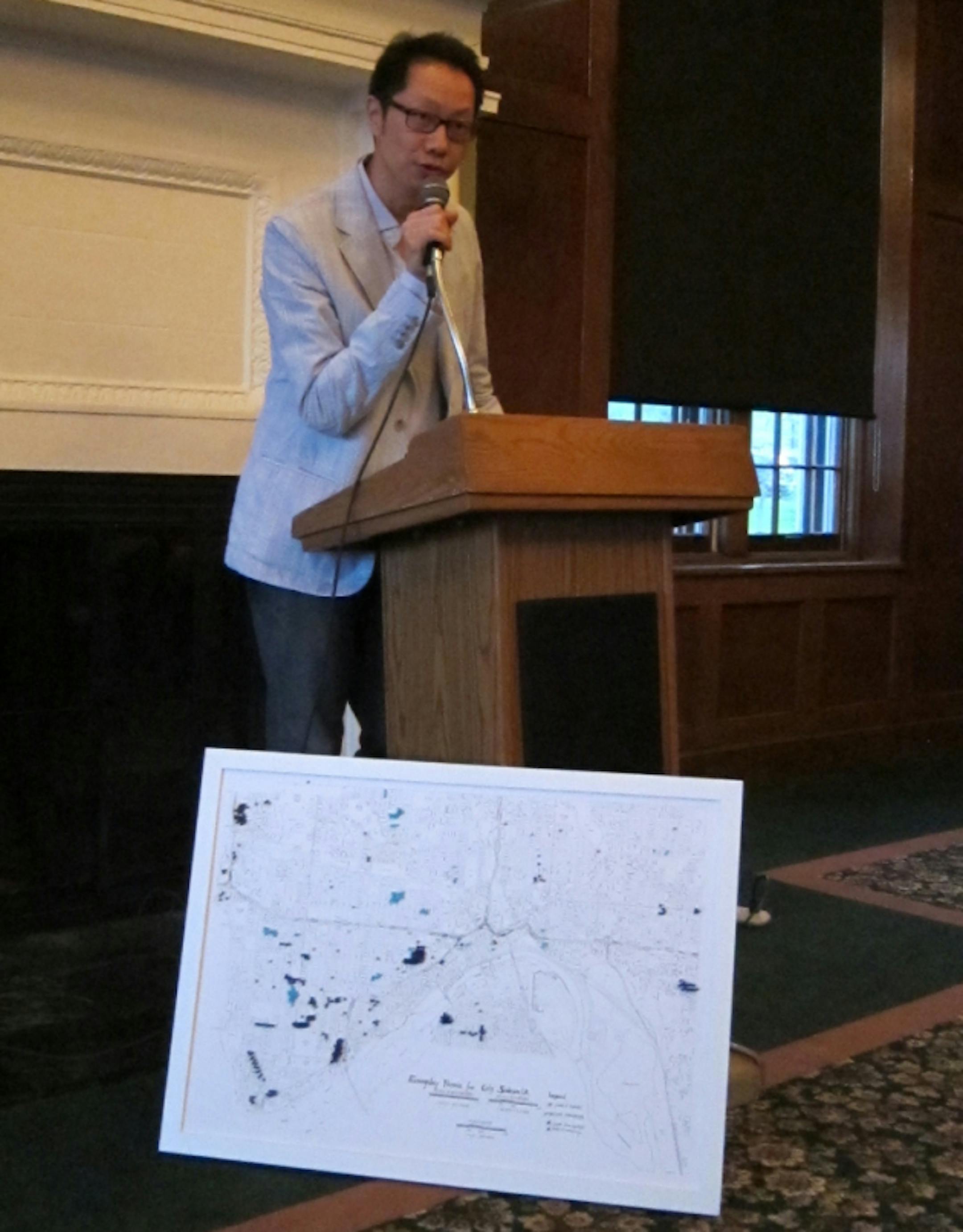 Marcus Young, with a map of where all the sidewalk poems are in St. Paul.