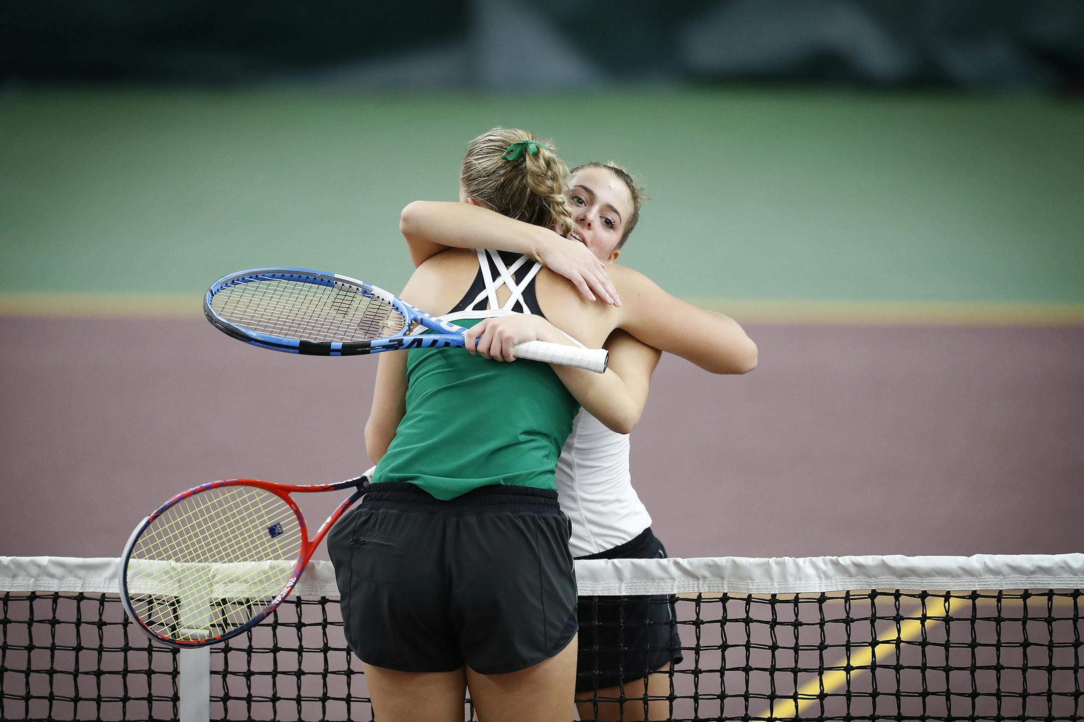 Nicole Copeland, right, of Edina High School hugs teammate Andrea Jansson after defeating her in two sets to win the Class 2A tennis individual championship on Friday. Photo: LEILA NAVIDI ï leila.navidi@startribune.com