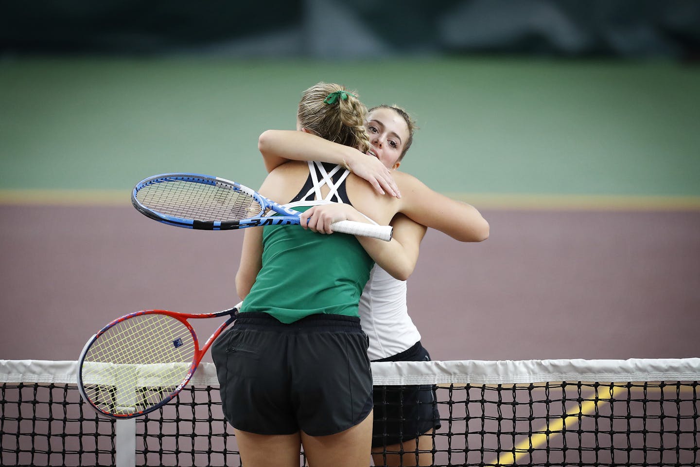 Nicole Copeland, right, of Edina High School hugs teammate Andrea Jansson after defeating her in two sets to win the Class 2A tennis individual championship on Friday. Photo: LEILA NAVIDI ï leila.navidi@startribune.com