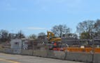 A 219-unit apartment complex is under construction on the site of the former YMCA near downtown Rochester. The project, called First & Banks, is being