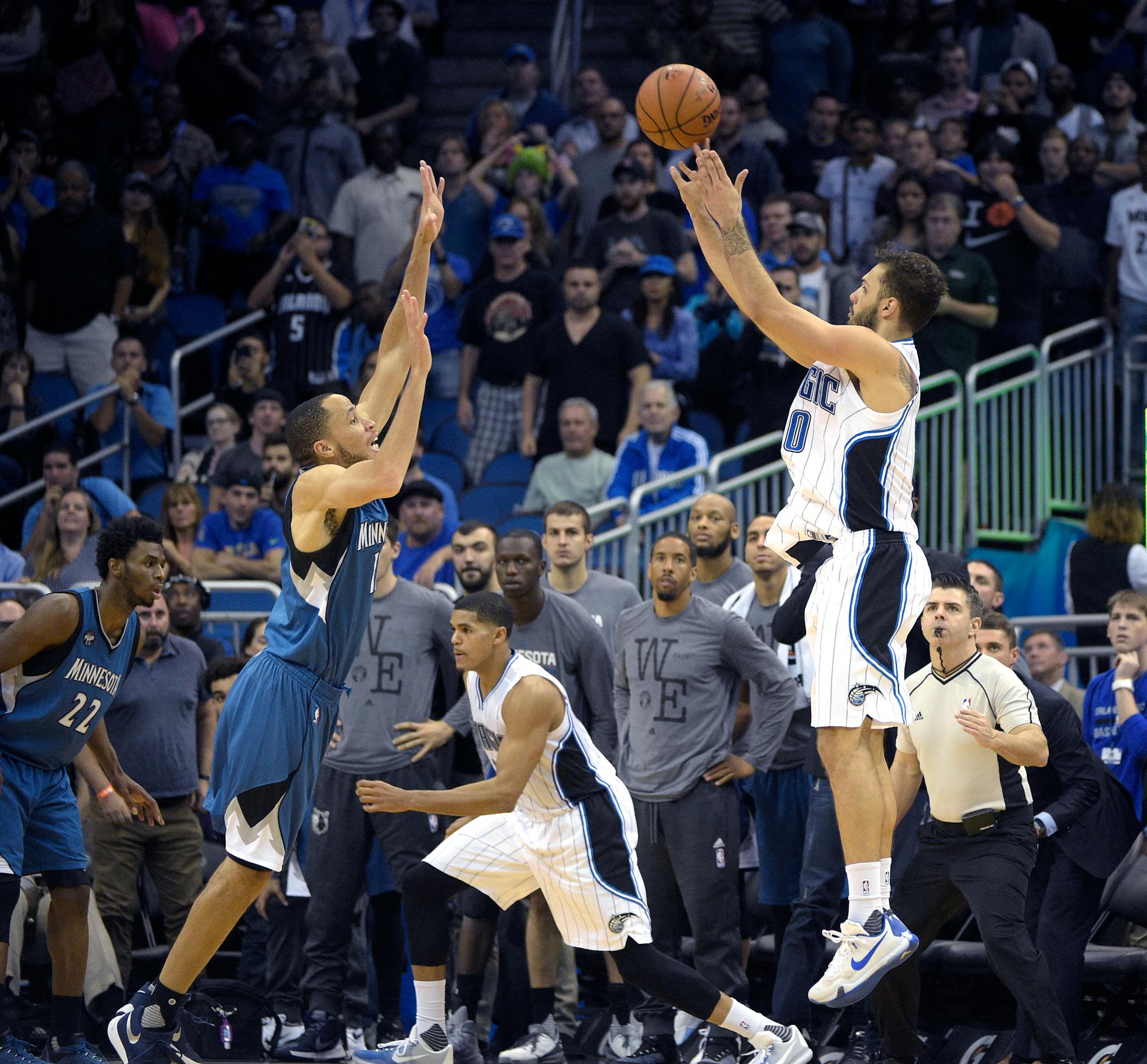 Orlando Magic forward Evan Fournier (10) hits a game-winning three-pointer in front of Minnesota Timberwolves forward Tayshaun Prince, left, during the overtime period of an NBA basketball game in Orlando, Fla., Wednesday, Nov. 18, 2015. The Magic won 104-101.