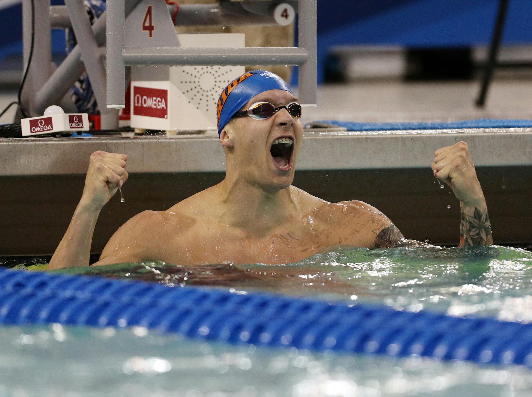 Florida's Caeleb Dressel celebrated after setting an all-time-record in the 100 yard butterfly Friday evening. ] ANTHONY SOUFFLE ï anthony.souffle@startribune.com Swimmers competed in the Division 1 NCAA men's swimming and diving championships Friday, March 23, 2018 at the Jean K. Freeman Aquatic Center on the grounds of the University of Minnesota in Minneapolis.