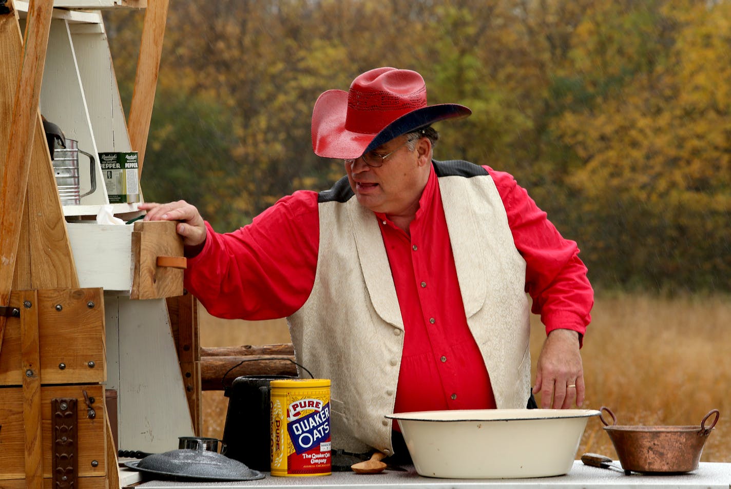 Jon Olson a Anoka County division manager with his rebuilt chuck wagon. Otsego, MN on October 15, 2013. ] JOELKOYAMA&#x201a;&#xc4;&#xa2;joel koyama@startribune Jon Olson rides a mule, makes his own buckskin clothes and built a 16-foot teepee in his basement. Now, the Anoka County division manager with two buggies in his barn has rebuilt a chuck wagon. This certified Mountain Man, known as Man Who Walks Like a Bear, has both boots firmly in the past, but his eye is on the future. About to retire