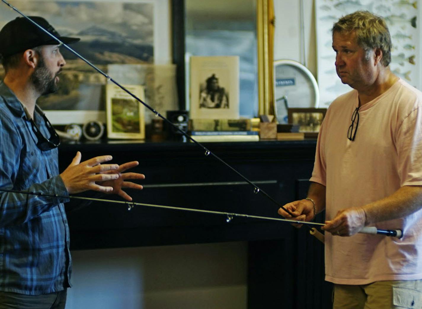 Robert Hawkins, owner of Bob Mitchell's Fly Shop explains the merit of different rod/reel combos to Jim Aronson who lives nearby in West Lakeland. Lake Elmo is a small village whose image contrasts with the sprawling city of Woodbury.]Richard tsong-taatarii/rtsong-taatarii@startribune.com ORG XMIT: MIN1506182137181686