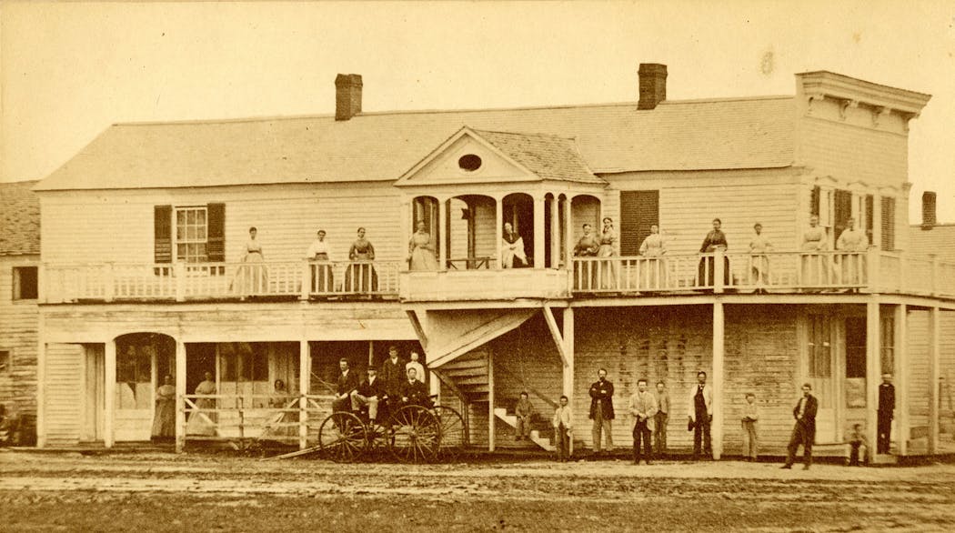 Staff and students stood outside a temporary location for the school for the deaf in the 1860s.