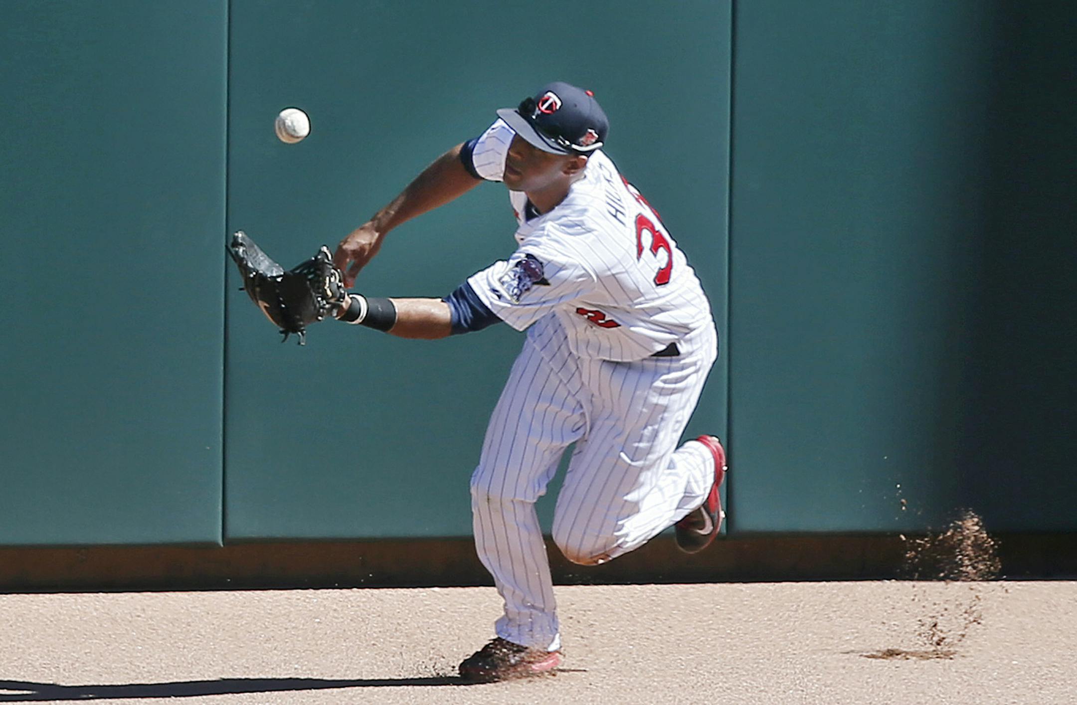 Minnesota Twins center fielder Aaron Hicks (32) reached for a triple hit by Los Angeles Angels first baseman C.J. Cron (20) in the firth inning. The Minnesota Twins hosted the Los Angles Angles at Target Field Sunday September 7 , 2014 in Minneapolis, MN . The Twins loss 14-4 to the Angles .] Jerry Holt Jerry.holt@startribune.com
