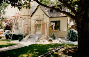 A Donnelly Stucco Company crew applies stucco to a home in St. Paul in 1992.