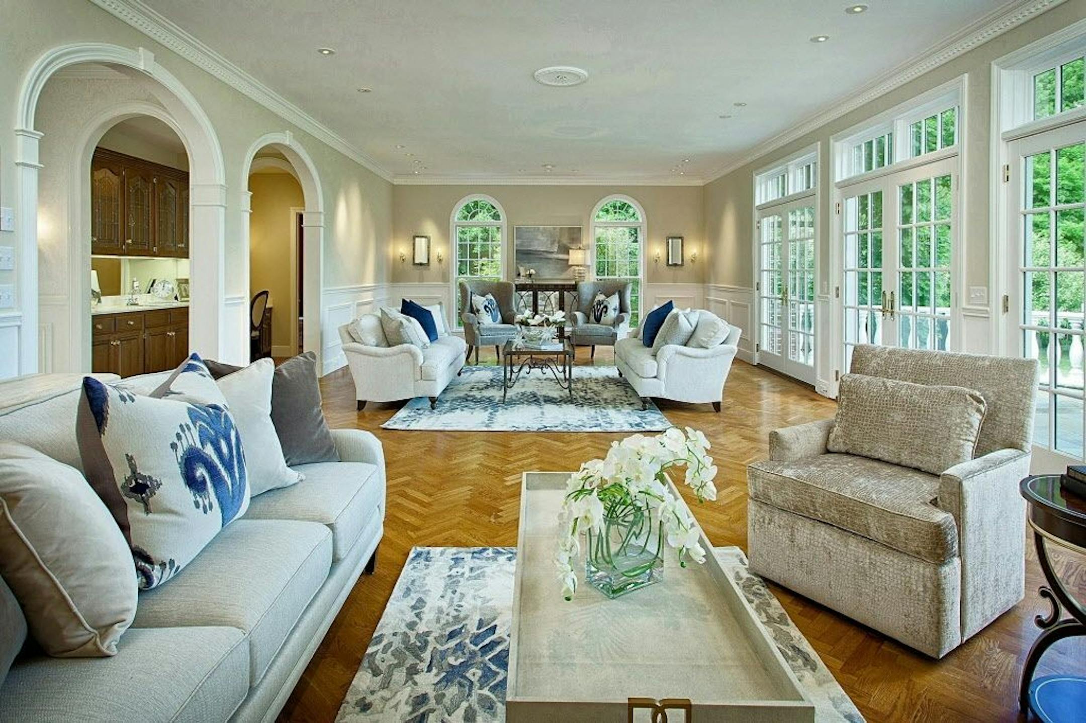 Another view of the spacious living room with a wet bar for entertaining.