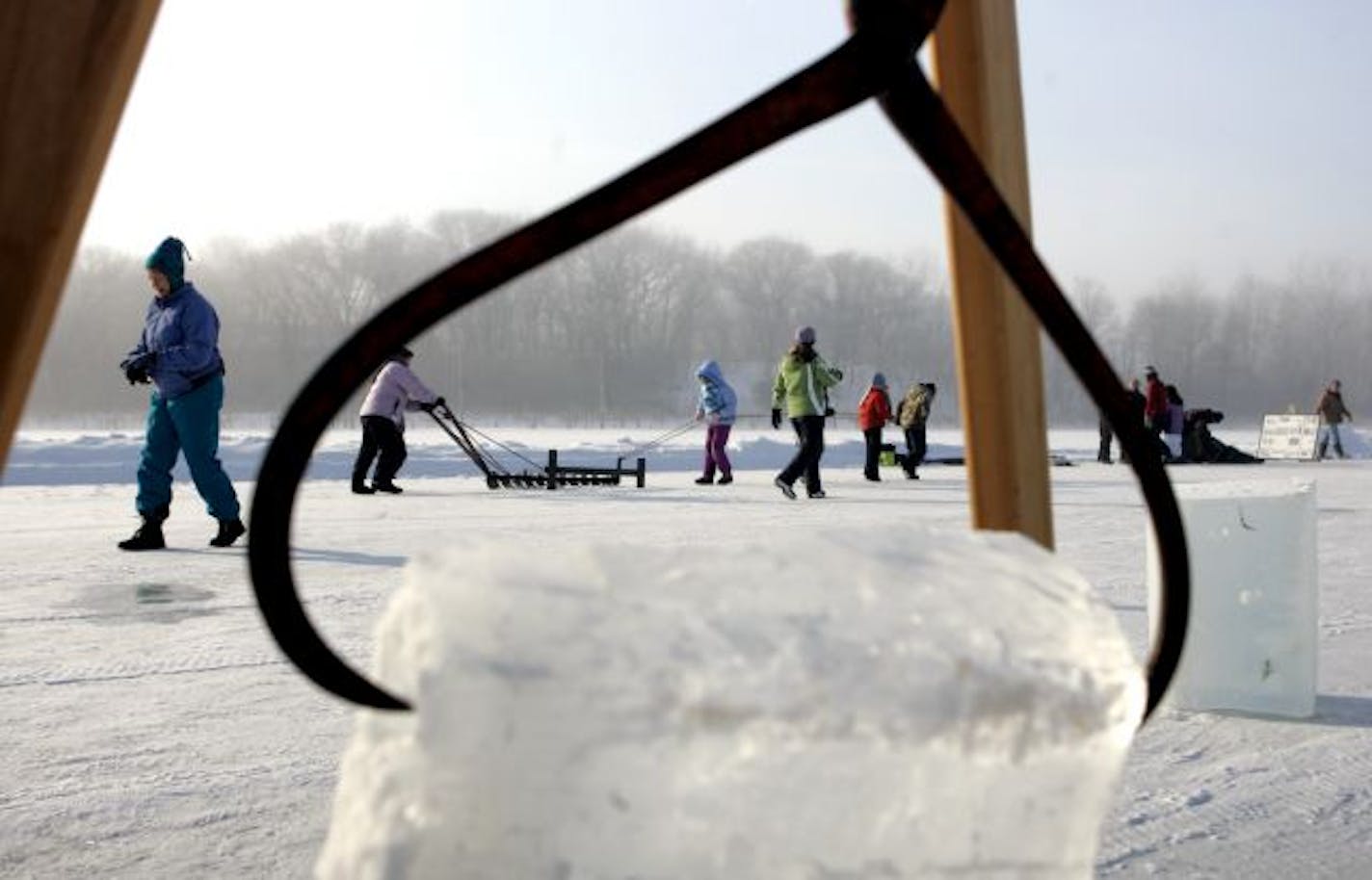 Students from Kenwood Elementary School in Minneapolis worked with a plow that scores the surface of the ice during an ice harvest history day at Hyland Park Reserve in Bloomington Thursday, Jan. 22, 2009. The ice harvest program, which is in its tenth year at Hyland Park Reserve, featured several stations for students, including cutting blocks, marking the ice with a plow, weighing blocks, making small cubes and many others.