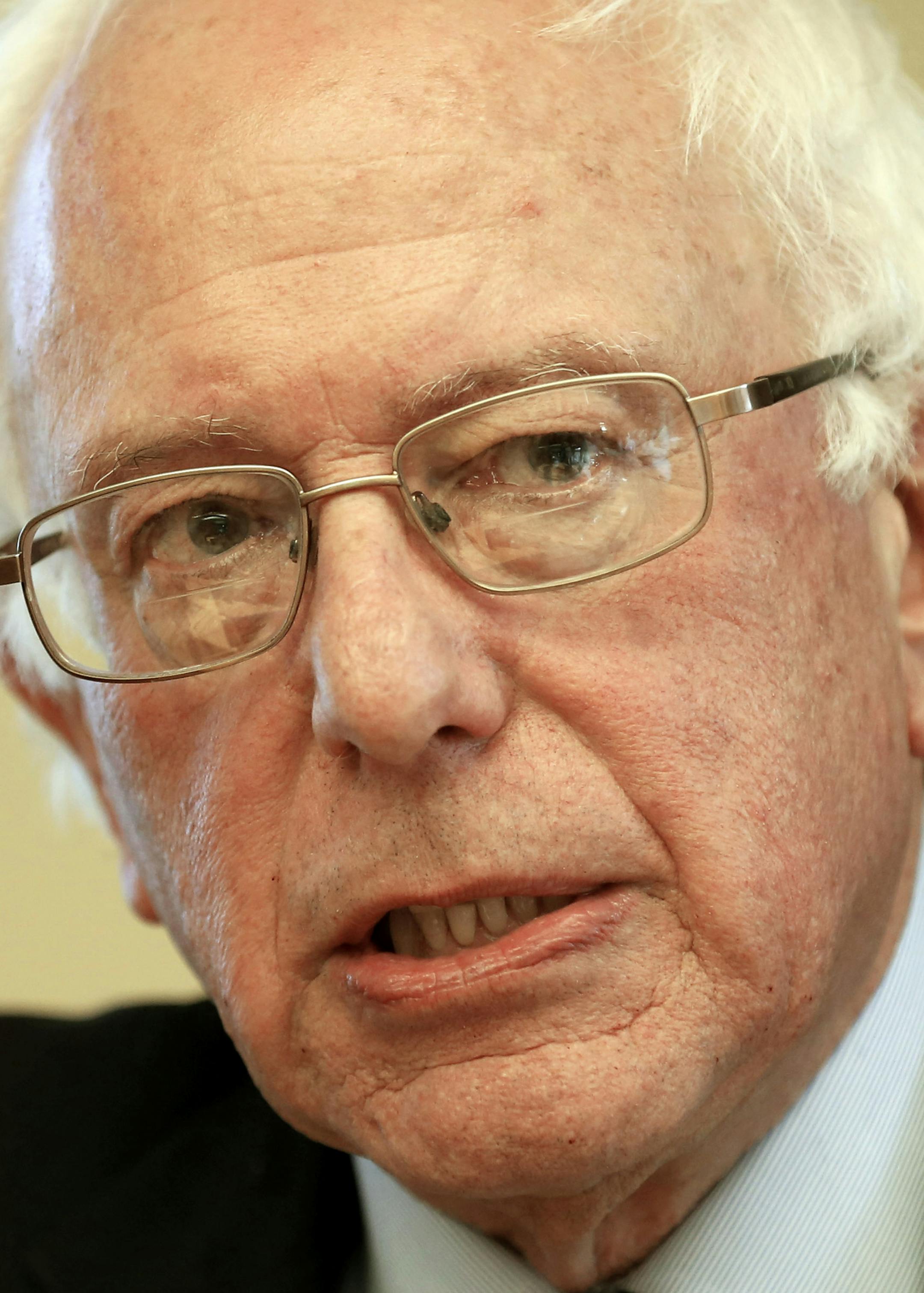 In this photo taken Oct. 30, 2015, Democratic presidential candidate Sen. Bernie Sanders, I-Vt, speaks in Manchester, N.H. One year before Election Day 2016, Republicans are consumed by uncertainty and infighting while Democrats are coalescing behind Hillary Rodham Clinton. But there's a long way to go. (AP Photo/Jim Cole)