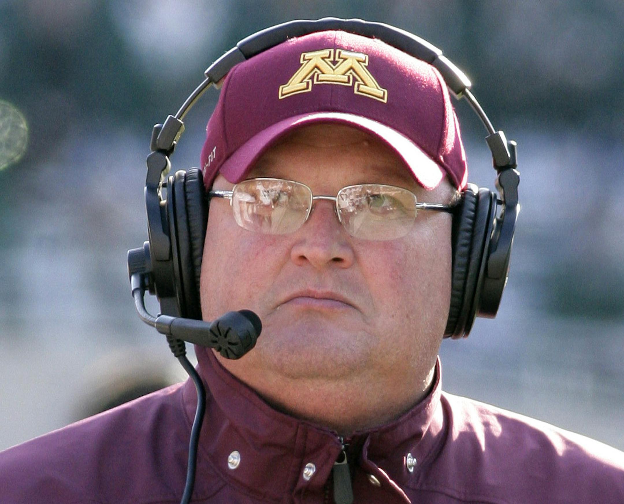 Minnesota acting head coach Tracy Claeys walks the sideline during the third quarter of an NCAA college football game against Michigan State, Saturday, Nov. 30, 2013, in East Lansing, Mich. Michigan State won 14-3. (AP Photo/Al Goldis) ORG XMIT: ELJ115