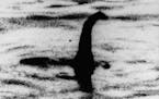 FILE - This undated file photo shows a shadowy shape that some people say is a the Loch Ness monster in Scotland. On Thursday, Sept. 5, 2019, scientis