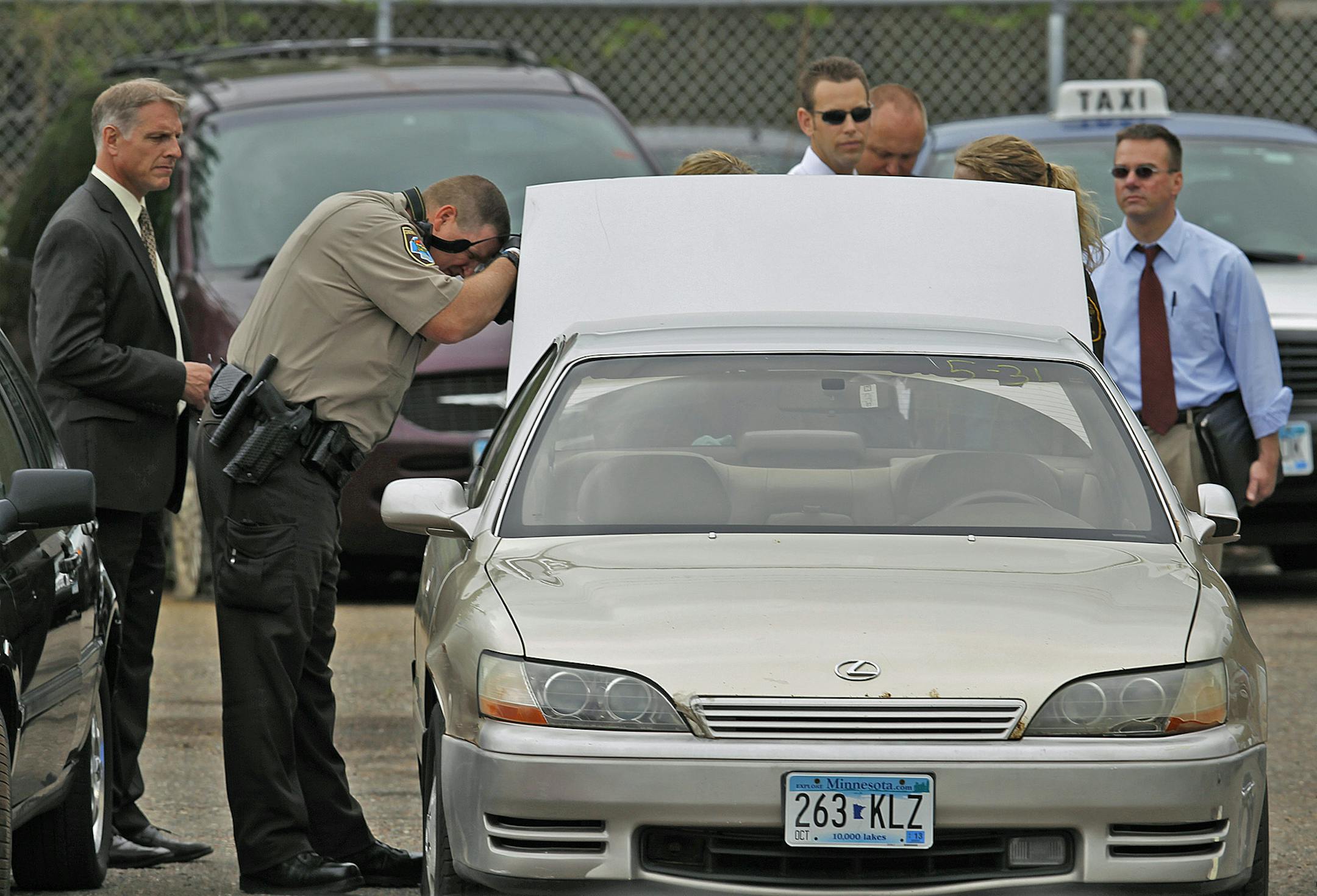 A body was found in a car at Wrecker Services, Monday, May 20, 2013. (ELIZABETH FLORES/STAR TRIBUNE) ELIZABETH FLORES • eflores@startribune.com