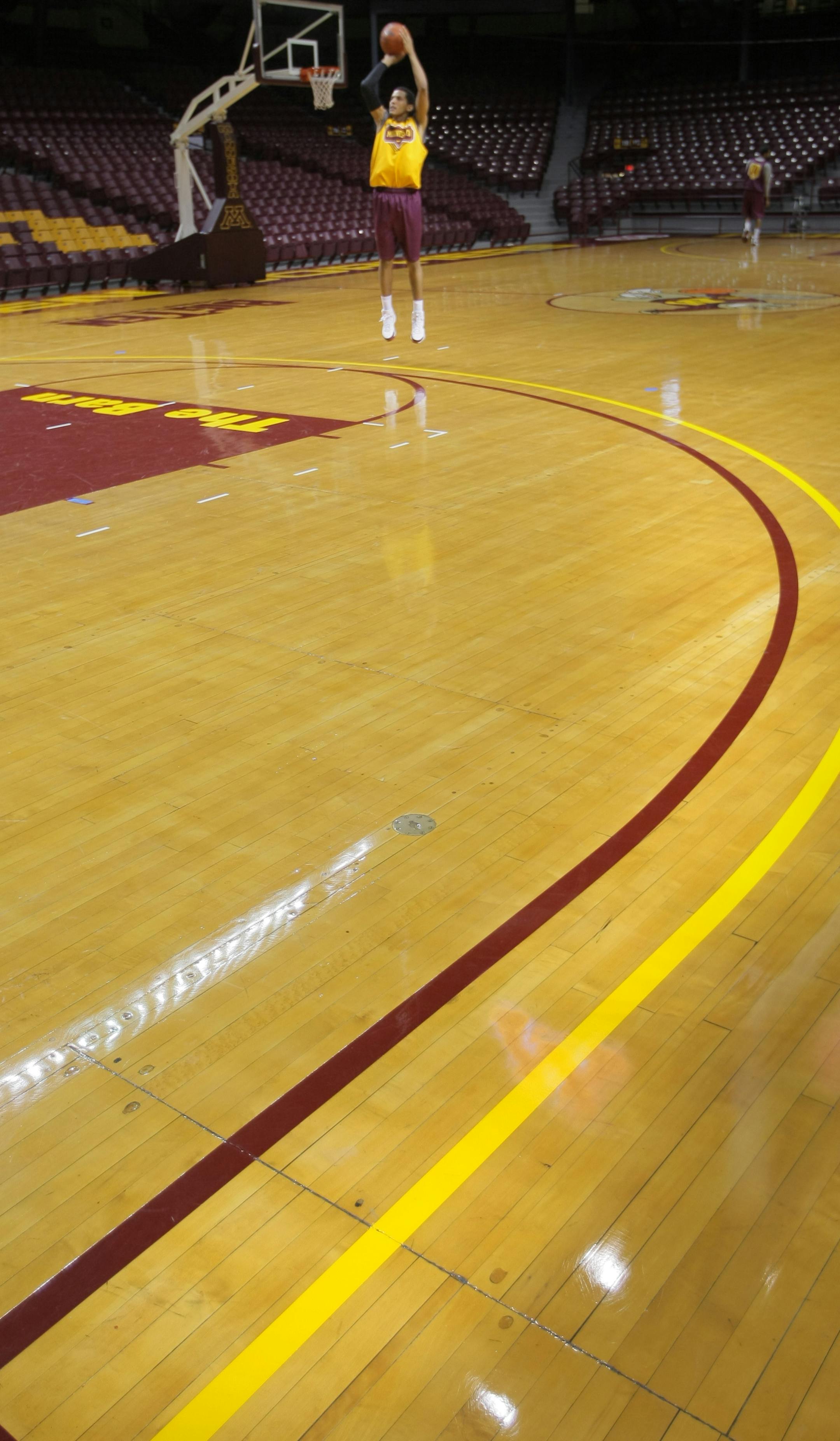 Devoe Joseph, freshman guard for the U of M basketball team, practices a few three pointers from the new line that's been moved out a foot to 20 feet 9 inches from 19 feet 9 inches.