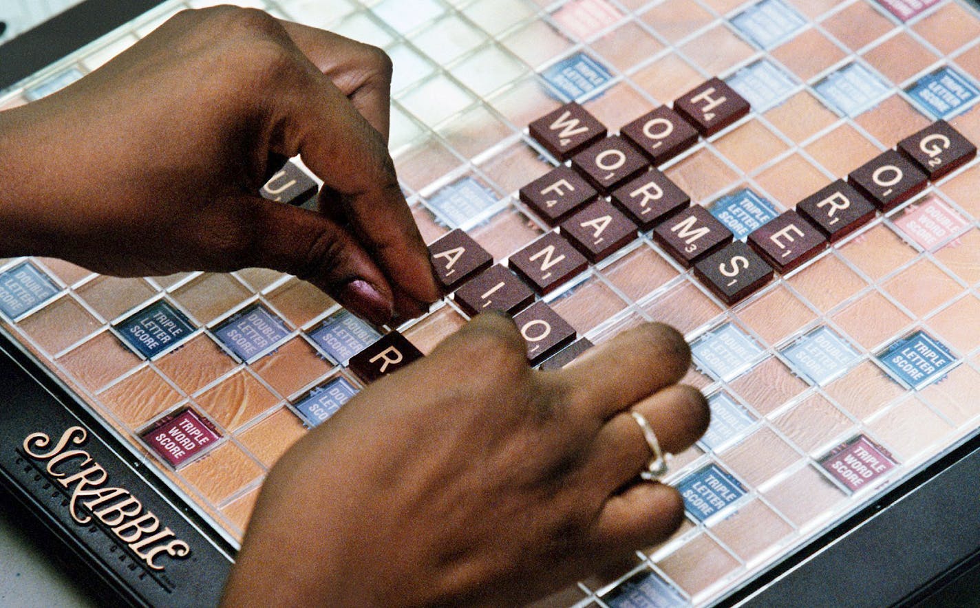 Linda Williams of Laurel, Maryland, places her letters during a 2001 Scrabble tournament sponsored by the National Scrabble Association Club 171. Illustrates SCRABBLE (category e), by Sarah Kaplan © 2015, The Washington Post. Moved Friday, May 22, 2015. (MUST CREDIT: Washington Post photo by Michael DiBari Jr.)