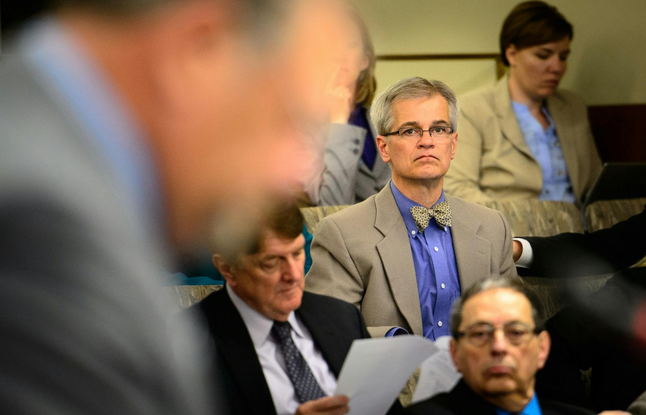 Sen. John Marty looked up at Majority Leader Tom Bakk at the start of the session. Marty objected strongly to provisions in the Environment bill.