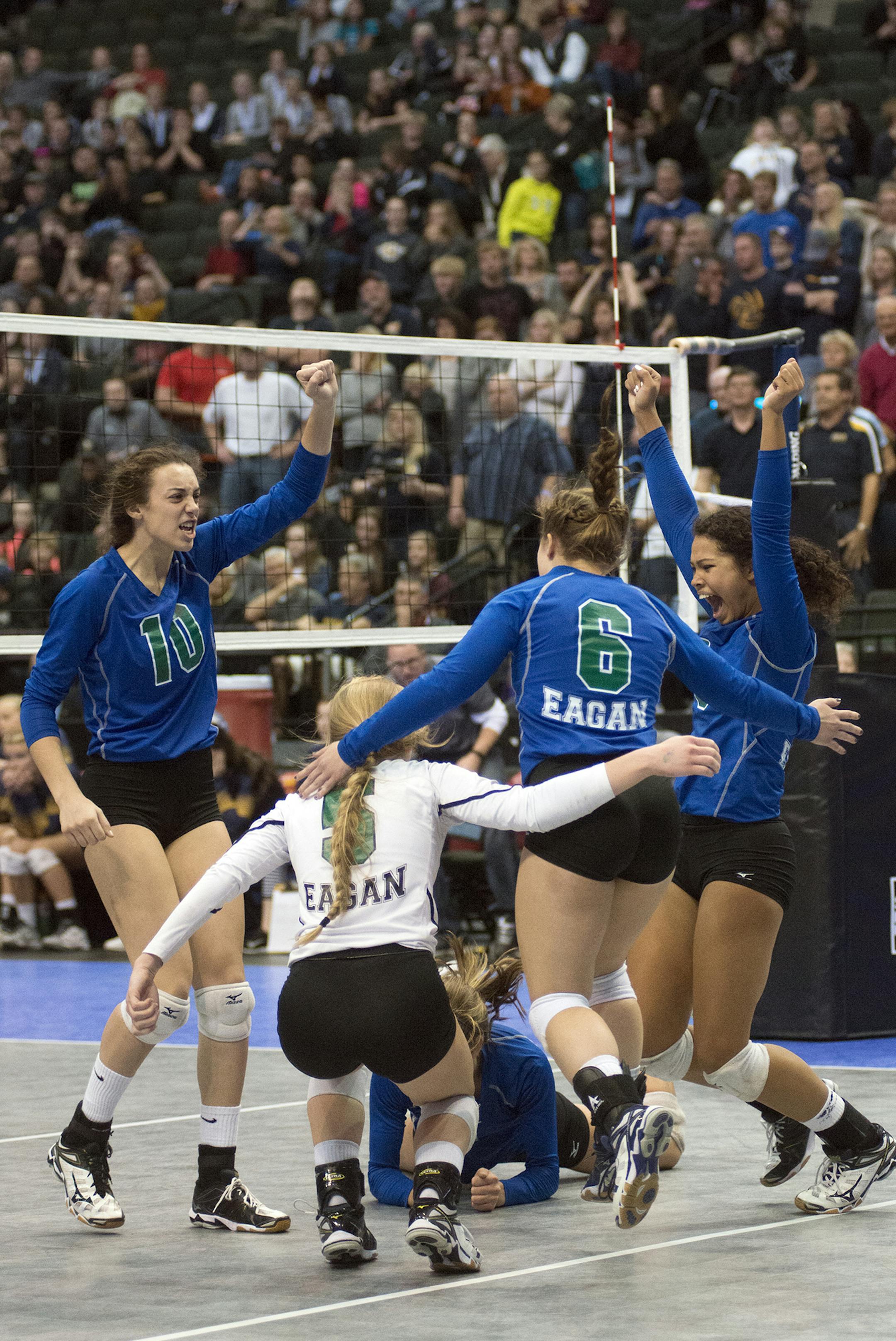Eagan rushes the court after winning an intense 5 set match against Prior Lake during the Girls 3A State Volleyball Championship Saturday at the Xcel Energy Center in Saint Paul. ] (Matthew Hintz, 111515, Saint Paul)
