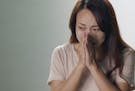 In this image made from an online ad made in China in 2016, a female character described struggling with the social pressure to get married.