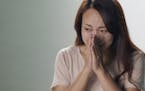 In this image made from an online ad made in China in 2016, a female character described struggling with the social pressure to get married.
