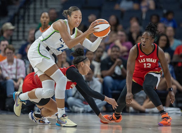 Lynx forward Napheesa Collier and Las Vegas Aces forward Alysha Clark (7), and guard Chelsea Gray (12), battle for the ball on the court during the se