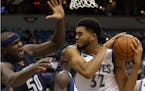 Minnesota Timberwolves center Karl-Anthony Towns (32) pulls down a rebound against Memphis Grizzlies forward Zach Randolph (50) during the second half