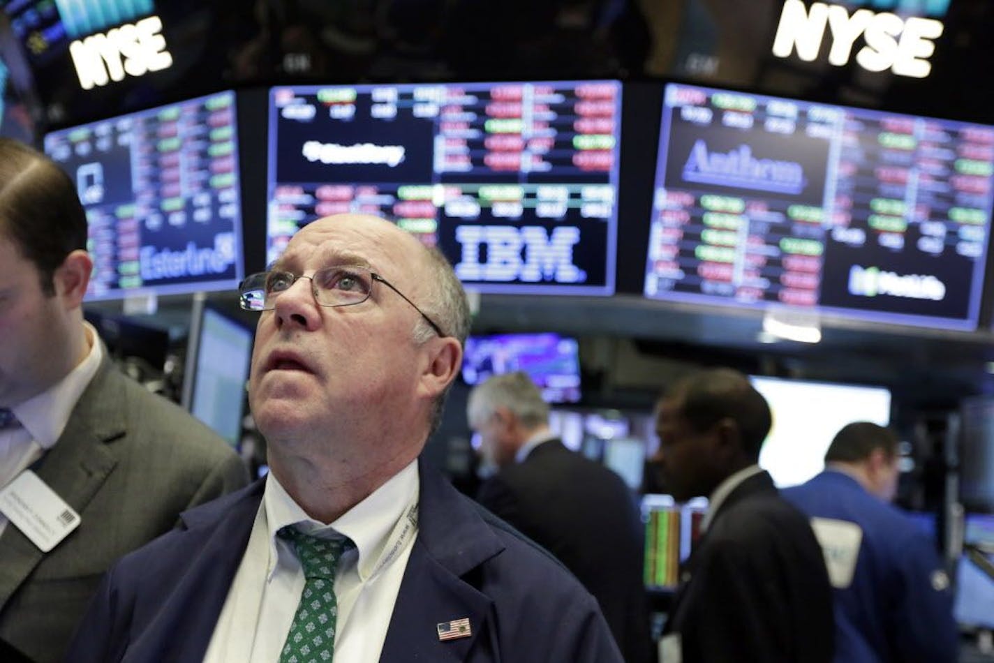 Trader Frederick Reimer works on the floor of the New York Stock Exchange, Tuesday, Feb. 6, 2018. The Dow Jones industrial average fell as much as 500 points in early trading, bringing the index down 10 percent from the record high it reached on Jan. 26. The DJIA quickly recovered much of that loss.