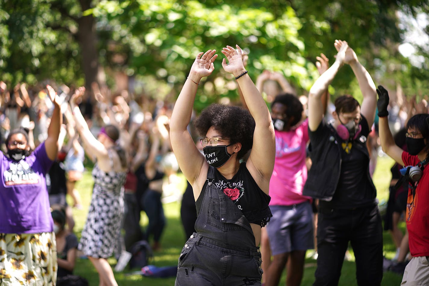 Chris Rame 18, a hiphop dance teacher did some yoga in the Loring Park after marching with Taking Back Pride march though downtown Minneapolis on Sunday, June 28. Many Pride weekend activities were canceled due to the pandemic.