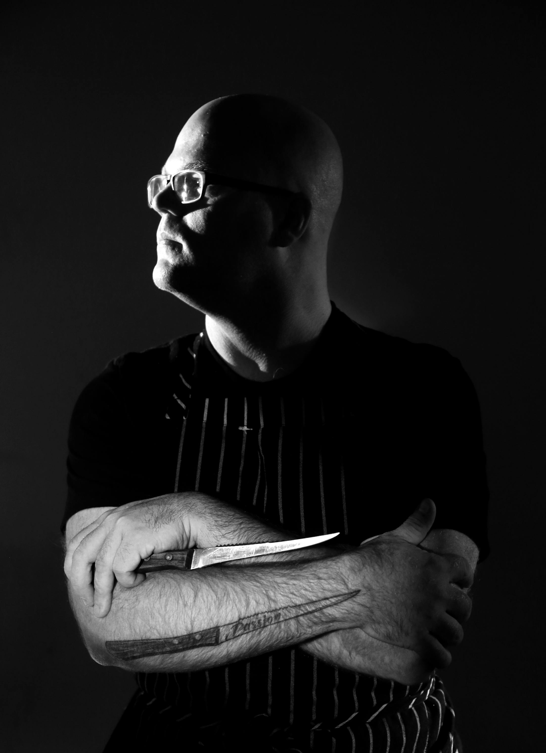 JD Fratzke of The Strip Club Meat & Fish for a 010414 story on chefs with tattoos.