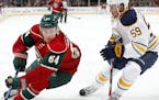 Mikael Granlund (64) and Tim Schaller (59) fought for position in the first period. ] CARLOS GONZALEZ &#xef; cgonzalez@startribune.com - October 1, 20