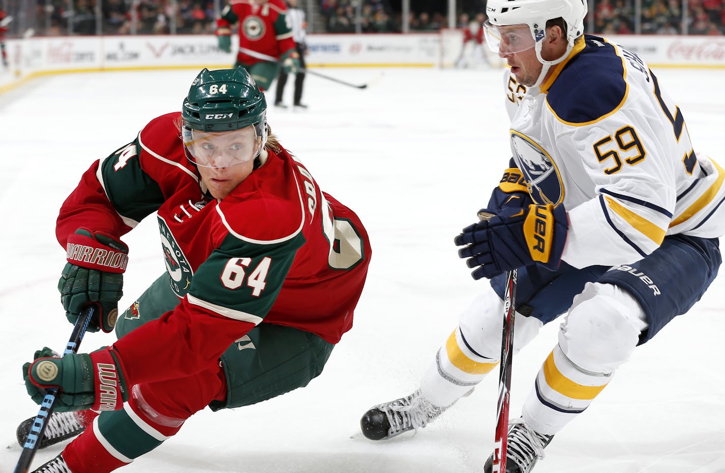 Mikael Granlund (64) and Tim Schaller (59) fought for position in the first period. ] CARLOS GONZALEZ &#xef; cgonzalez@startribune.com - October 1, 2015, St. Paul, MN, Xcel Energy Center, NHL, Minnesota Wild vs. Buffalo Sabres