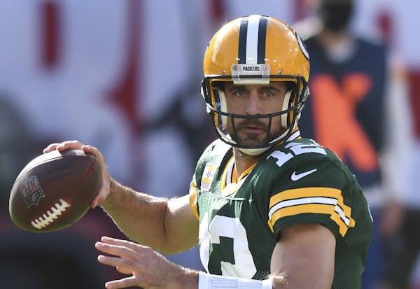 Green Bay Packers quarterback Aaron Rodgers (12) throws a pass against the Tampa Bay Buccaneers during the first half of an NFL football game Sunday, 