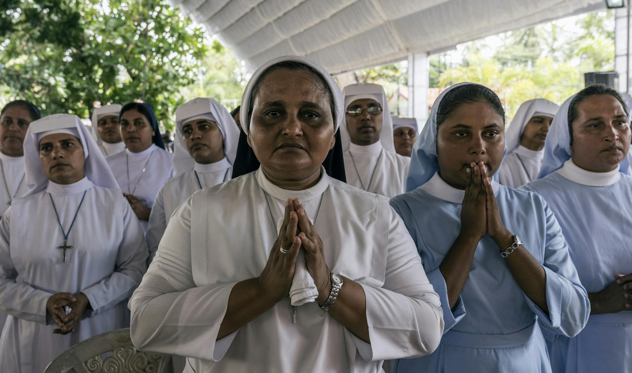 Nuns pray at a mass funeral at St. Sebastian’s Church in Negombo, Sri Lanka, on Tuesday, April 23 2019. The Islamic State claimed responsibility on Tuesday for the Easter Sunday bombings at churches and hotels in Sri Lanka that killed more than 300 people. (Adam Dean/The New York Times)