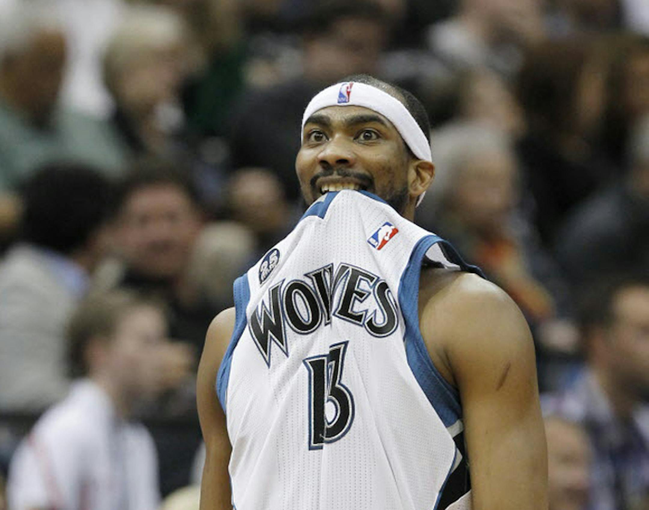 Minnesota Timberwolves forward Corey Brewer walks downcourt as a teammate shoots a free throw during the second quarter of an NBA basketball game against the Houston Rockets in Minneapolis, Friday, April 11, 2014.