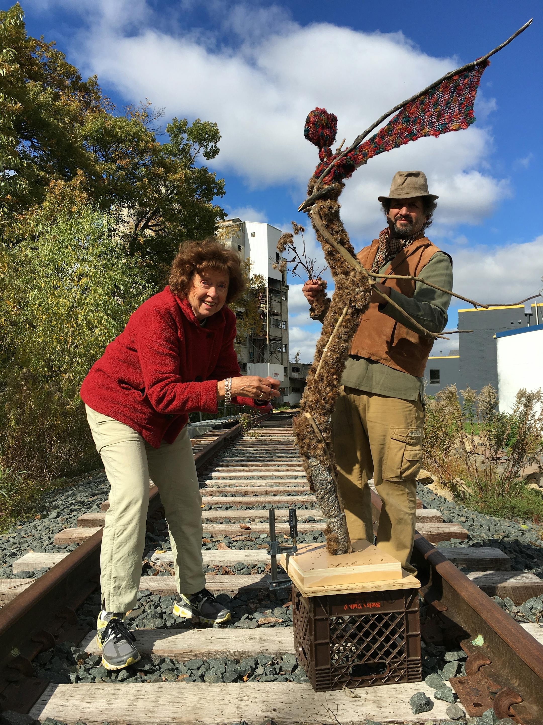 Artist Brant Kingman, right, and his mother Polly Penney, with a sculpture they created using sticks and burdock burs collected on walks near the railroad tracks behind his studio.