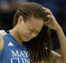 Minnesota Lynx guard Seimone Augustus (33) was helped off the court after sustaining a head injury in the third quarter Tuesday against the Phoenix Me