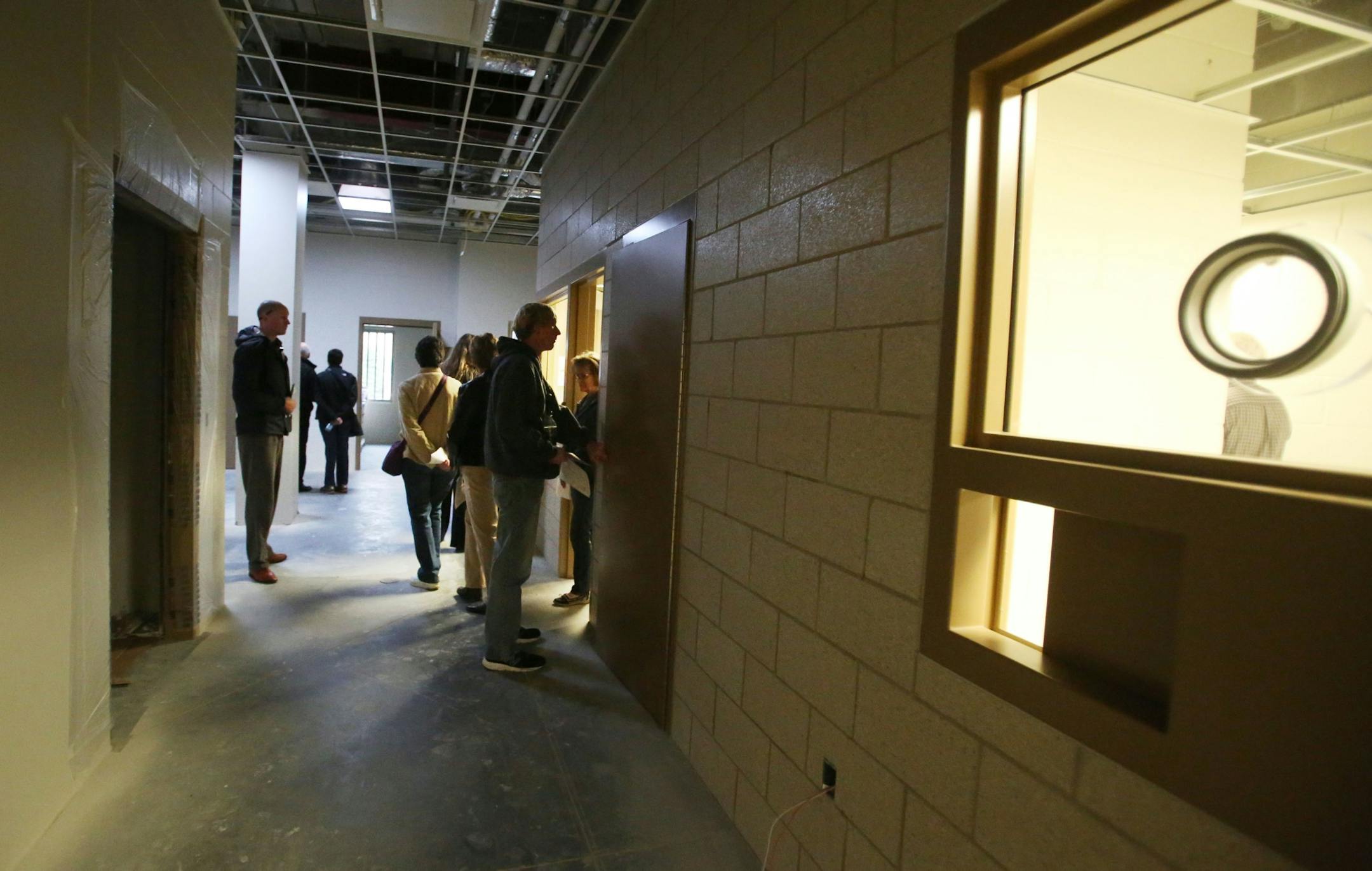 The Minnesota Security Hospital opened it's new $56 million facility to the public for a tour Wednesday, Oct. 12, 2016, in St. Peter, MN. Here, visitors look over one of the acute care wings of the not yet completed new facility.