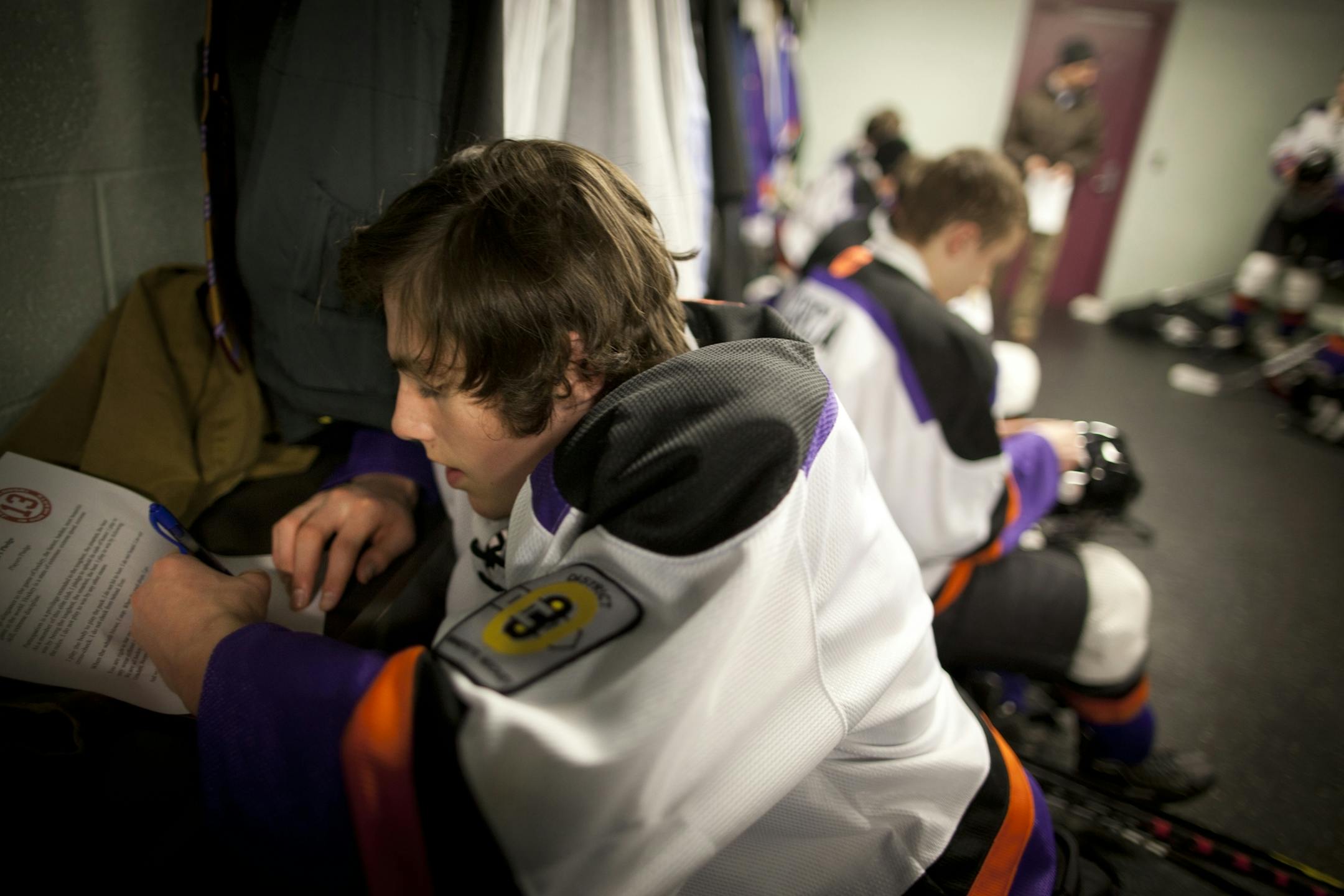 Minneapolis Storm Bantam A youth hockey player Cade Gleekel signed a pledge called Jack's Pledge along with his other teammates in the locker room before a game against Osseo/ Maple Grove at the Parade Ice Garden in Minneapolis, Minn., on Wednesday, January 11, 2012. They are the first team to take the pledge which was written in honor of Jack Jablonski who was paralyzed after a check from behind at a hockey game recently.
