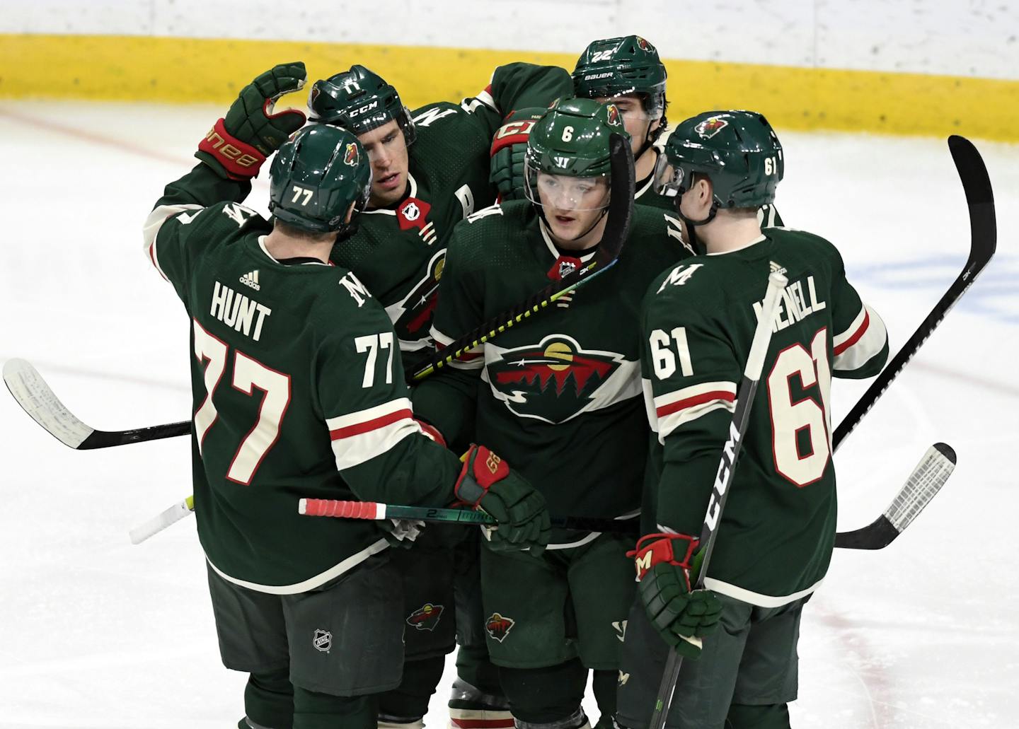 Minnesota Wild's Ryan Donato, center, breaks the team huddle after scoring against the Anaheim Ducks in the third period of an NHL hockey game, Tuesday, Dec. 10, 2019, in St. Paul, Minn. Anaheim won 3-2.(AP Photo/Tom Olmscheid)