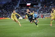 Minnesota United forward Teemu Pukki (22) pounces on the counterattack with Real Salt Lake center back Justen Glad (15) in pursuit Saturday night at A